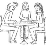 3 Personen am Tisch im Gespräch